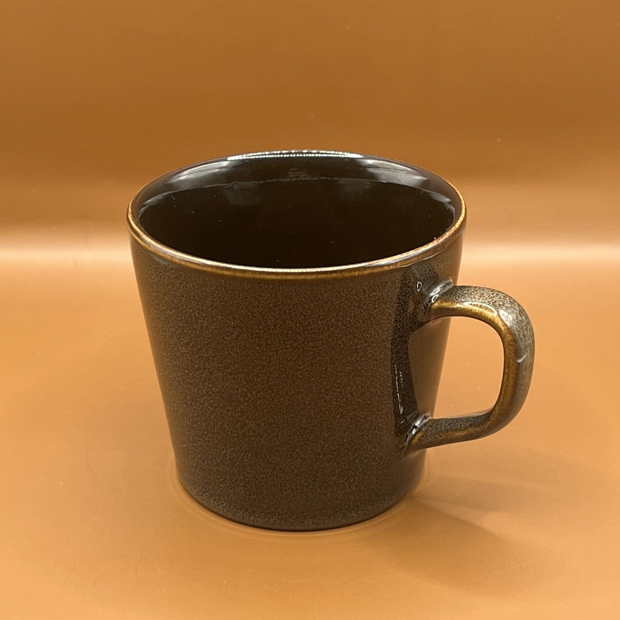 Dark brown textured mug with a kiln fired finish