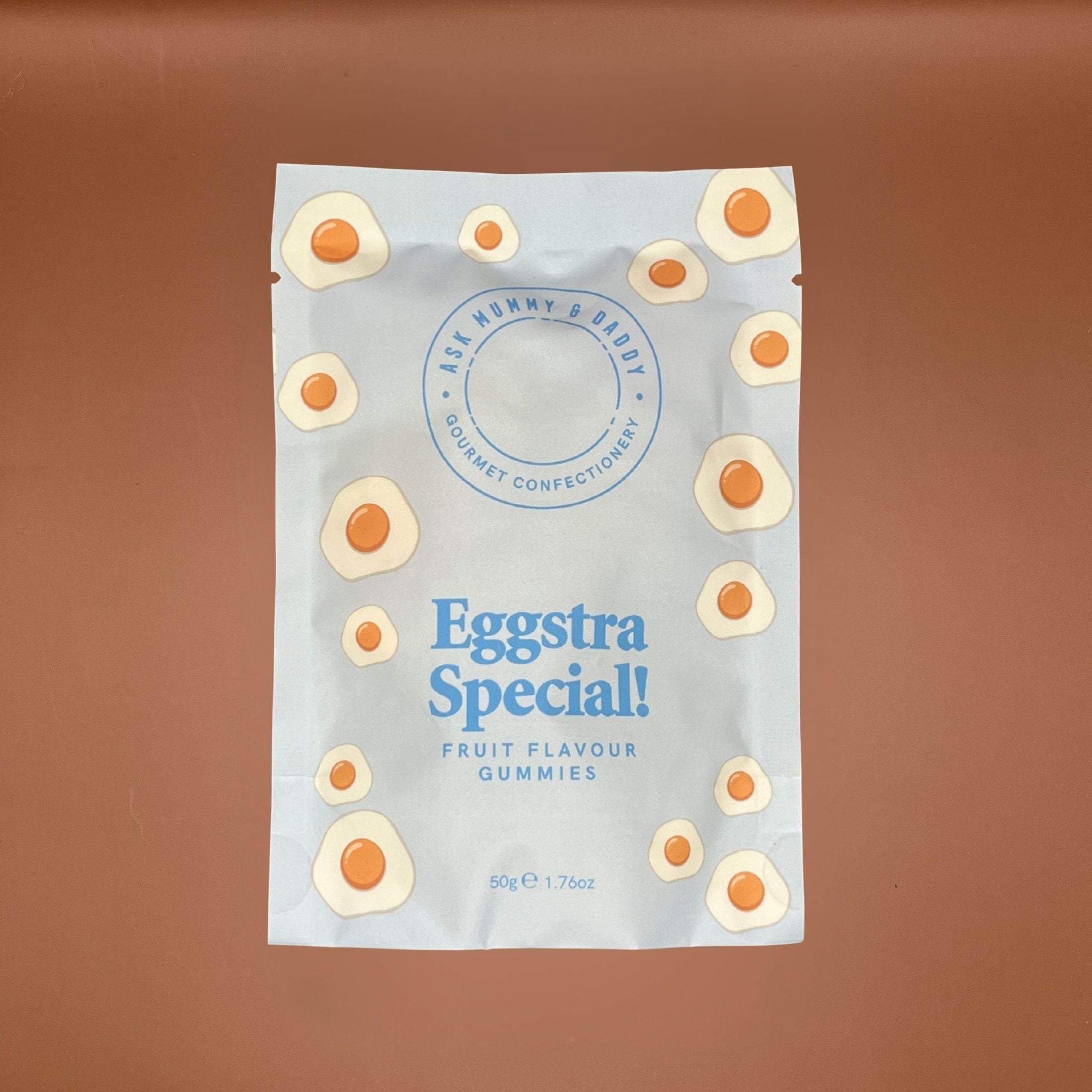 Packaging of Eggstra Special fruit flavor gummies on a brown background