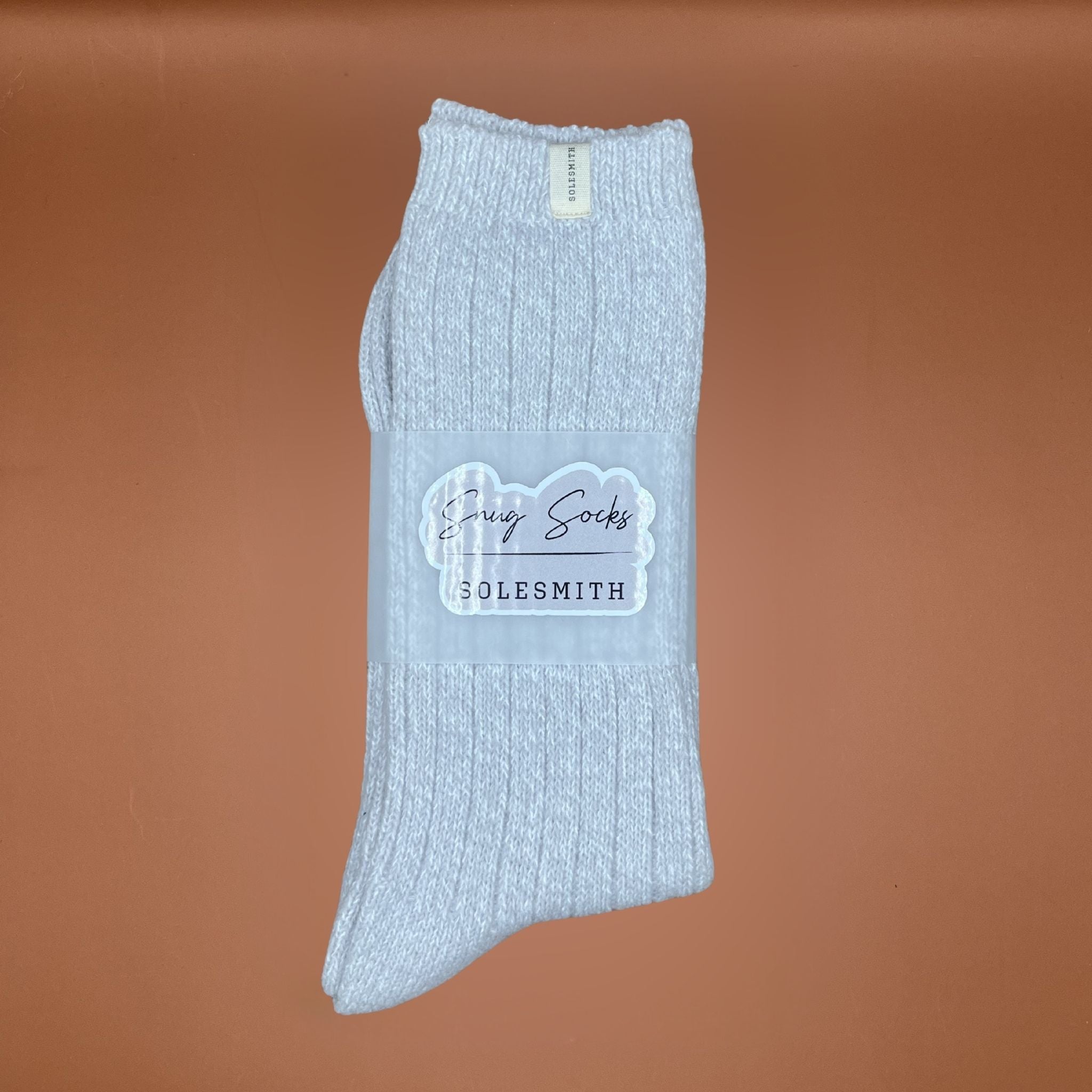 Greys ocks with 'Solesmith' label on a brown background