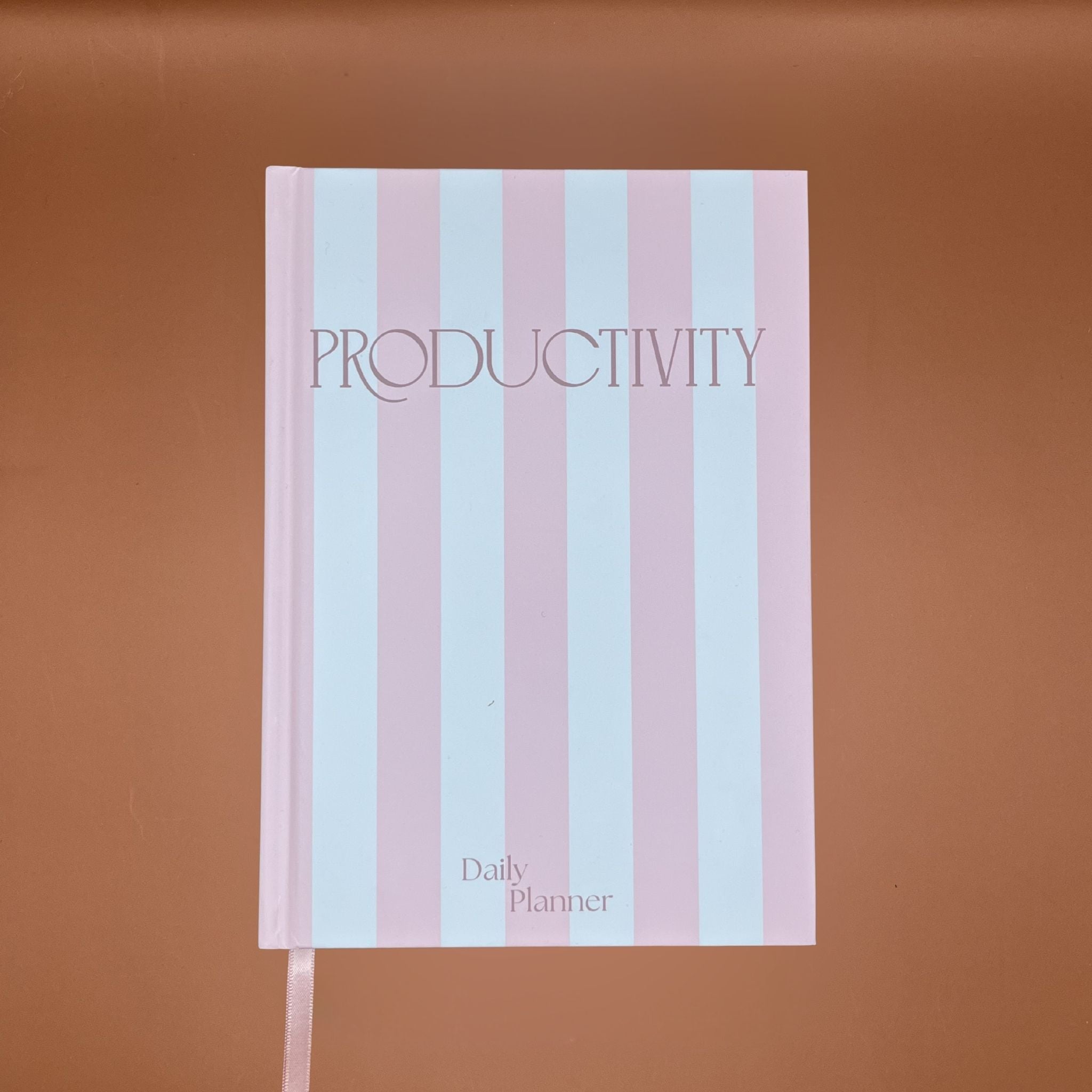 Daily planner with 'Productivity' text on a pink striped cover
