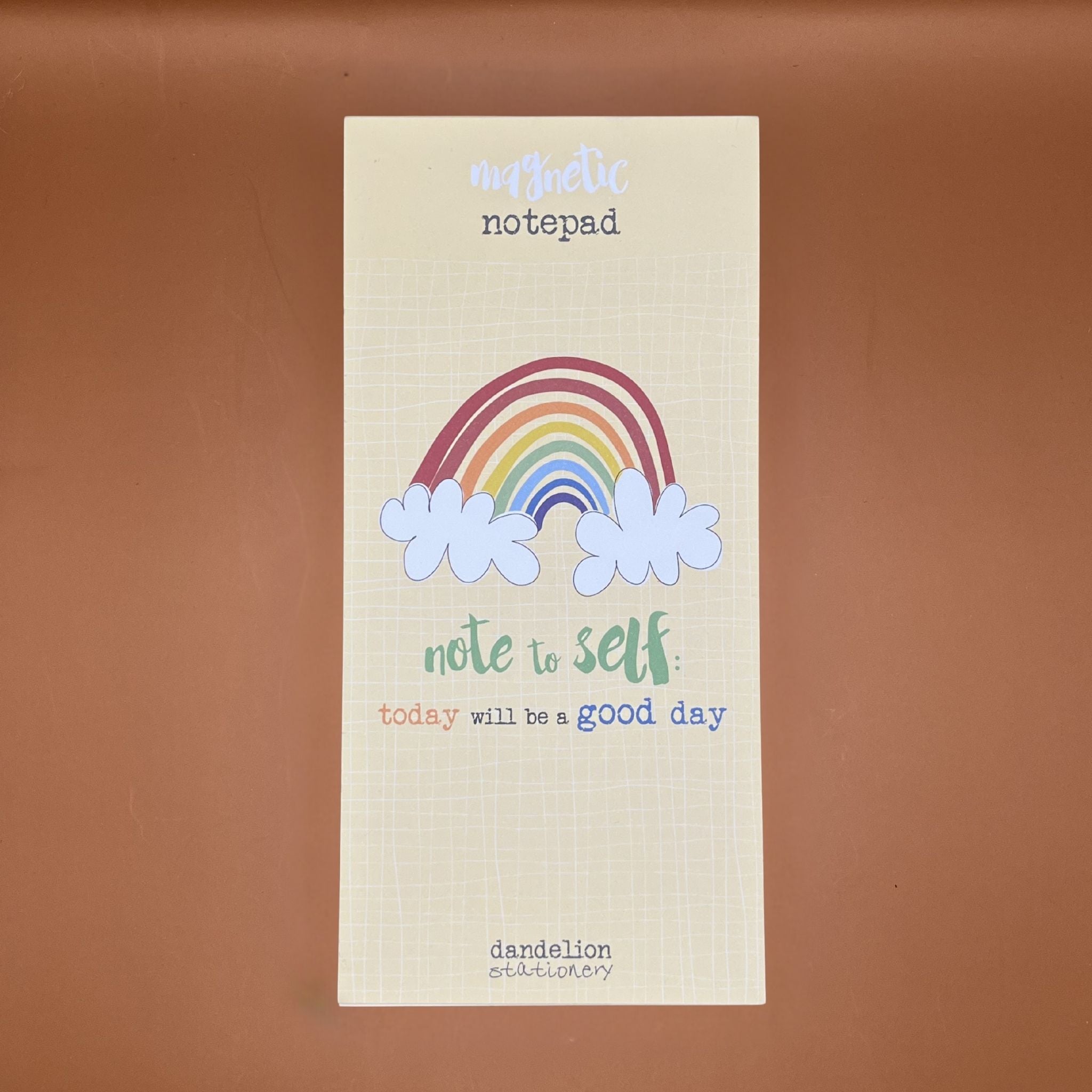 Notepad with rainbow and cloud design with text saying 'today will be a good day