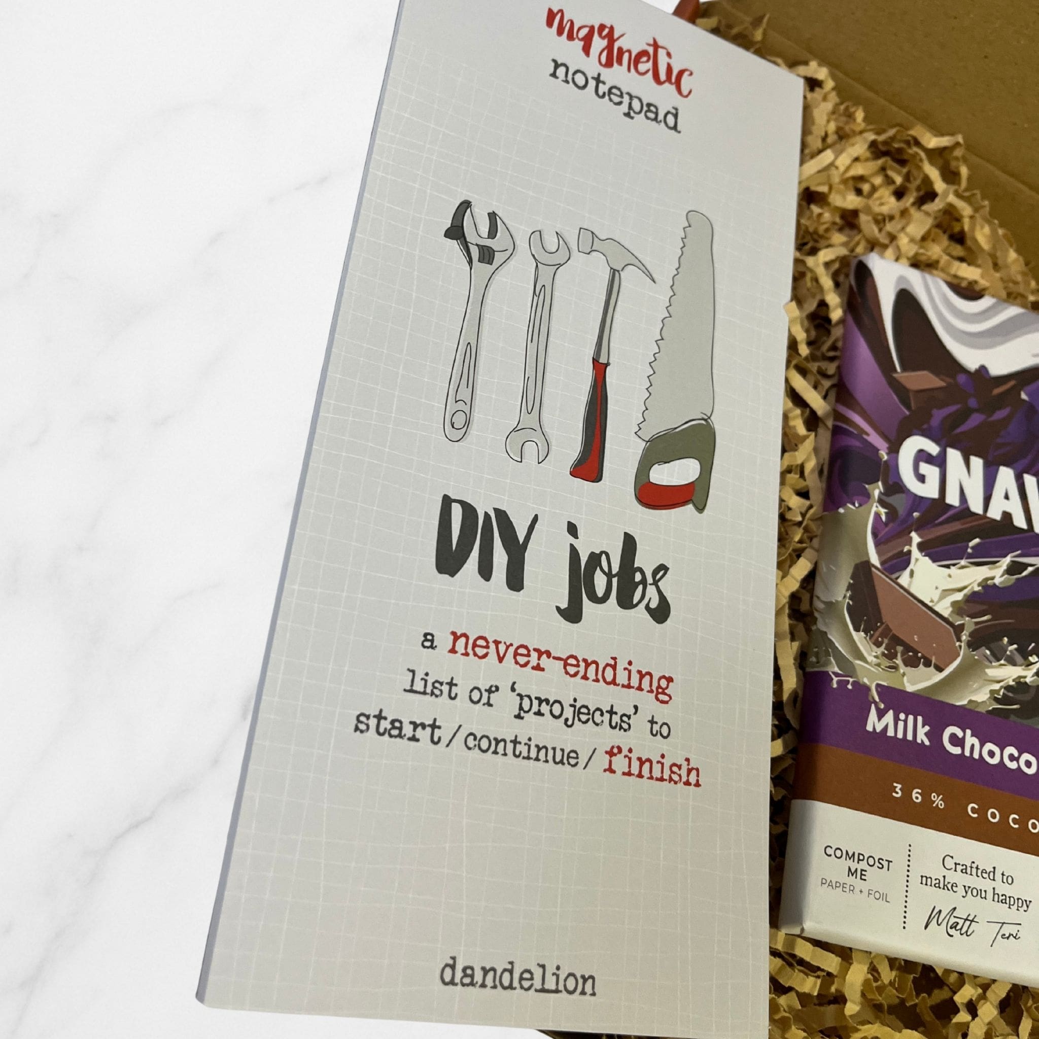 Magnetic notepad titled “DIY Jobs” featuring illustrated tools and humorous text about never-ending home improvement projects.