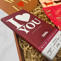 Close-up of Gnaw I Love You milk chocolate bar inside letterbox gift box.