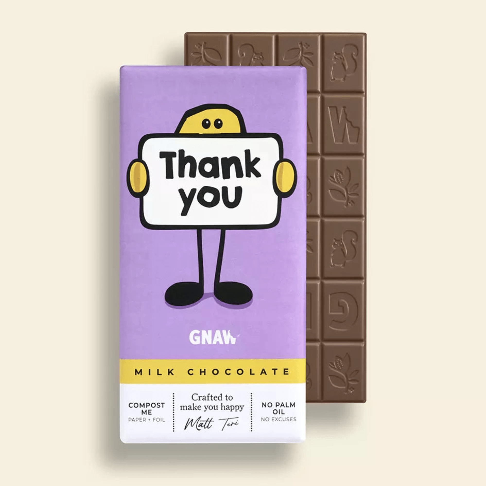 Milk chocolate bar with a purple packaging featuring a cartoon character holding a 'Thank you' sign on a beige background.