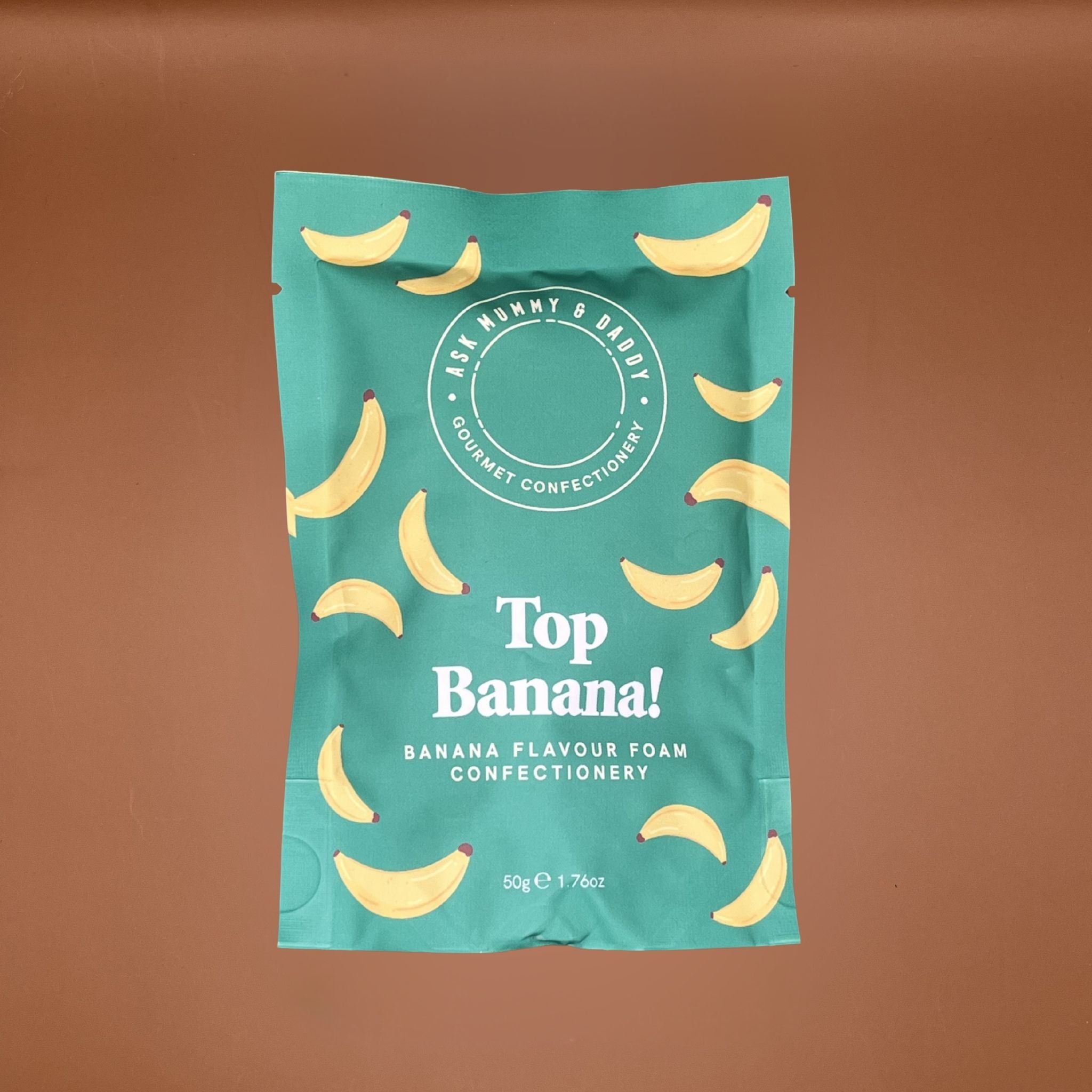 Teal package of 'Top Banana!' banana-flavored confectionery on a brown background