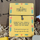 Yellow “Be a Pineapple” wish bracelet card with a small silver pineapple charm and motivational message.