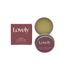 Dark pink lovely skincare berry cheesecake box next to open tin of berry vanilla lip balm.