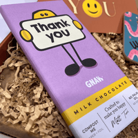 Close-up of Gnaw thank you milk chocolate bar inside letterbox gift box.