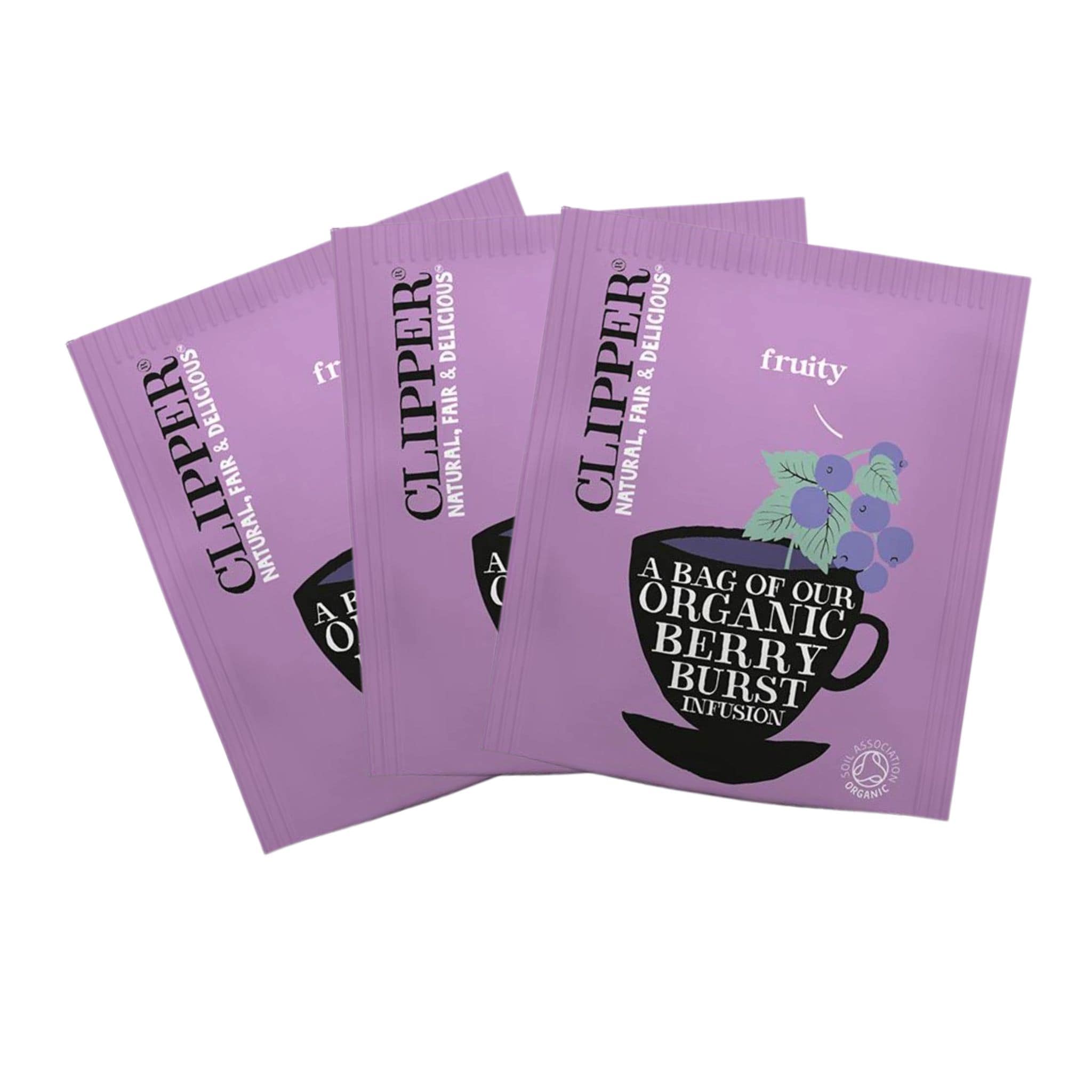 Three purple Clipper tea bags with a berry burst flavour. On the packet it says a bag of our organic berry burst.