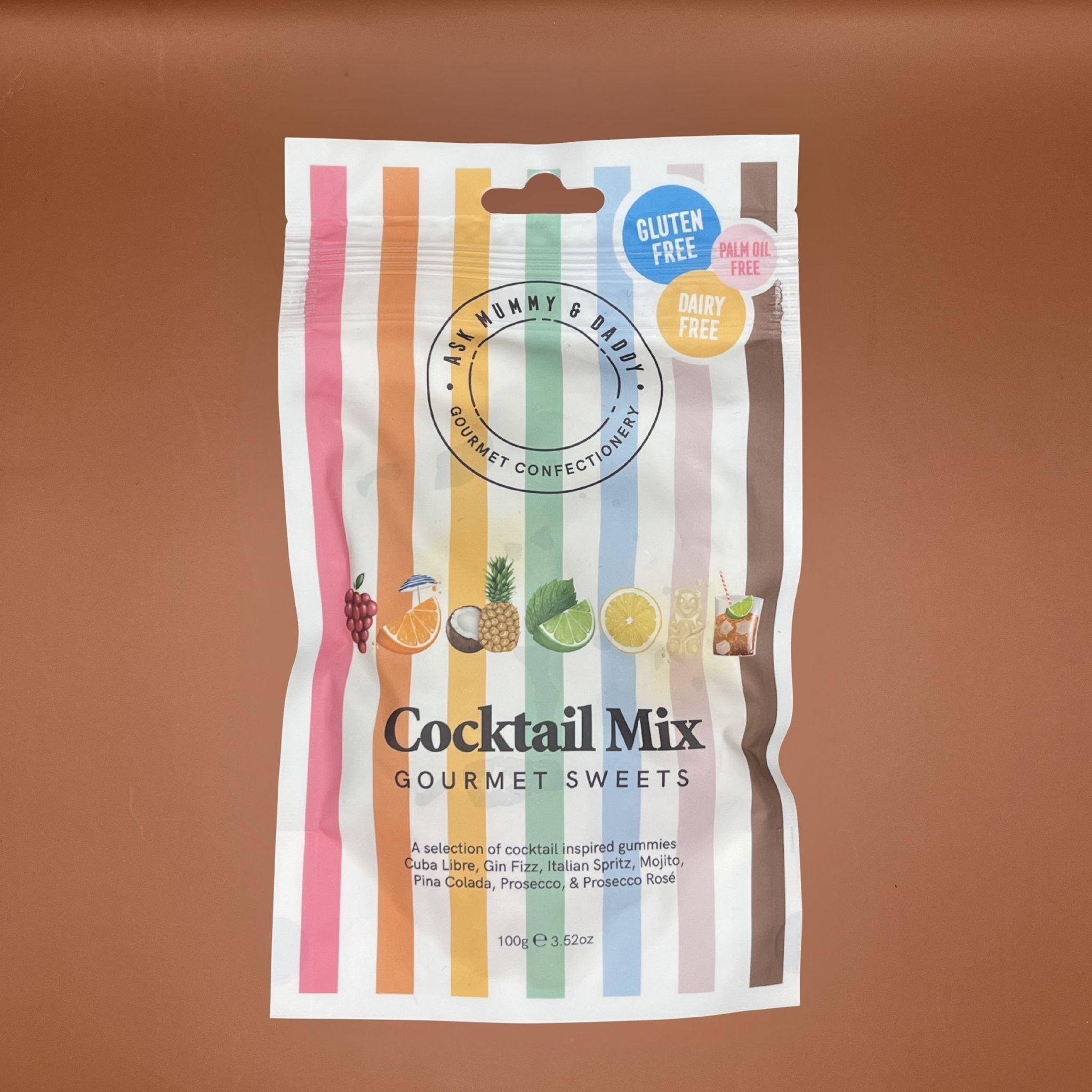 Packaging of cocktail mix gourmet sweets with colorful design on a brown background