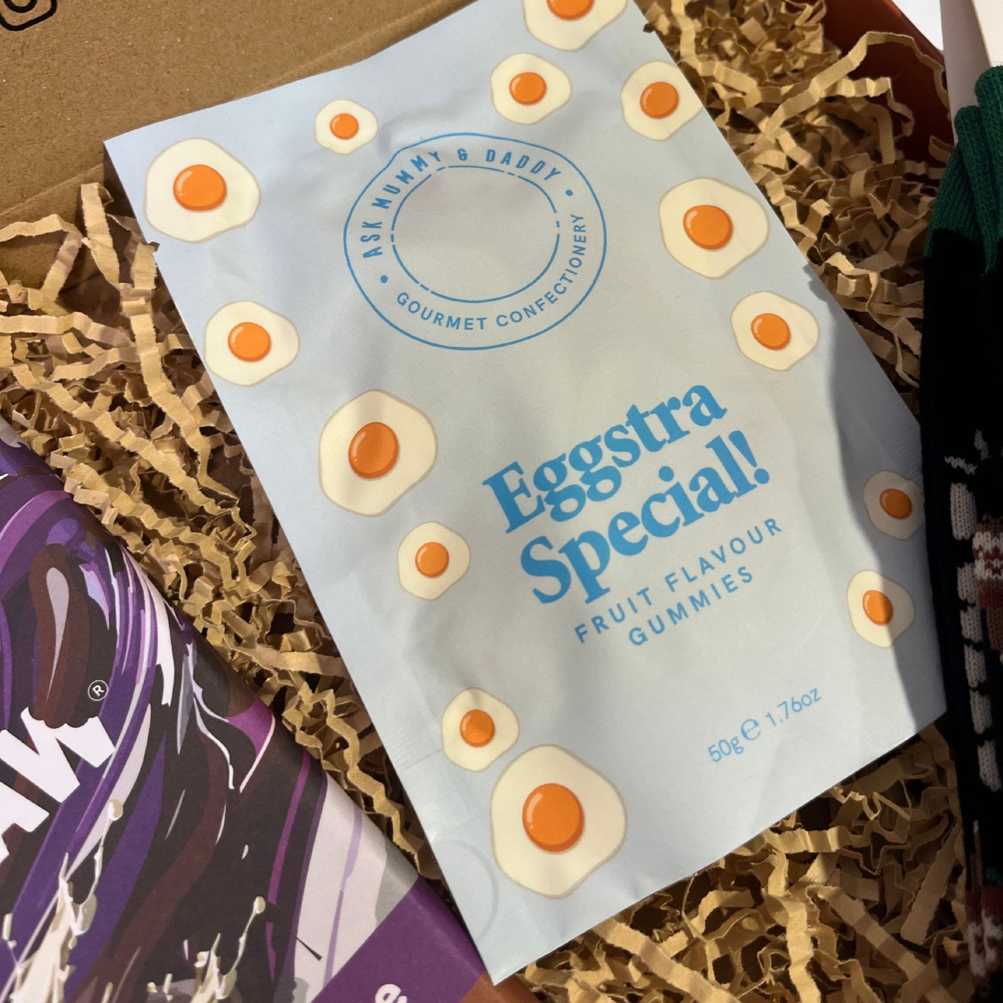 Bag of “Eggstra Special!” fruit flavour gummies from Ask Mummy & Daddy, decorated with fried egg sweet illustrations.