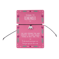 Pink card with an inspirational message with a bracelet and elephant charm.