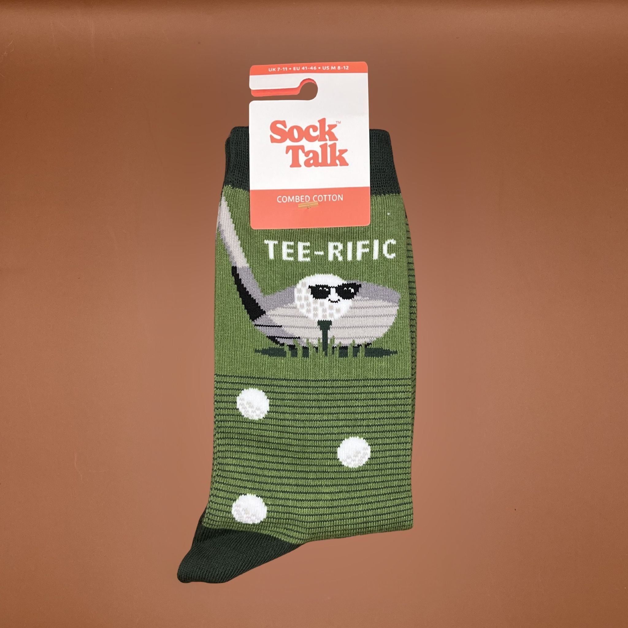 Green sock with golf-themed design and 'Sock Talk' packaging