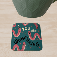 Funny celebration themed coaster featuring worms with party hats on a green background.