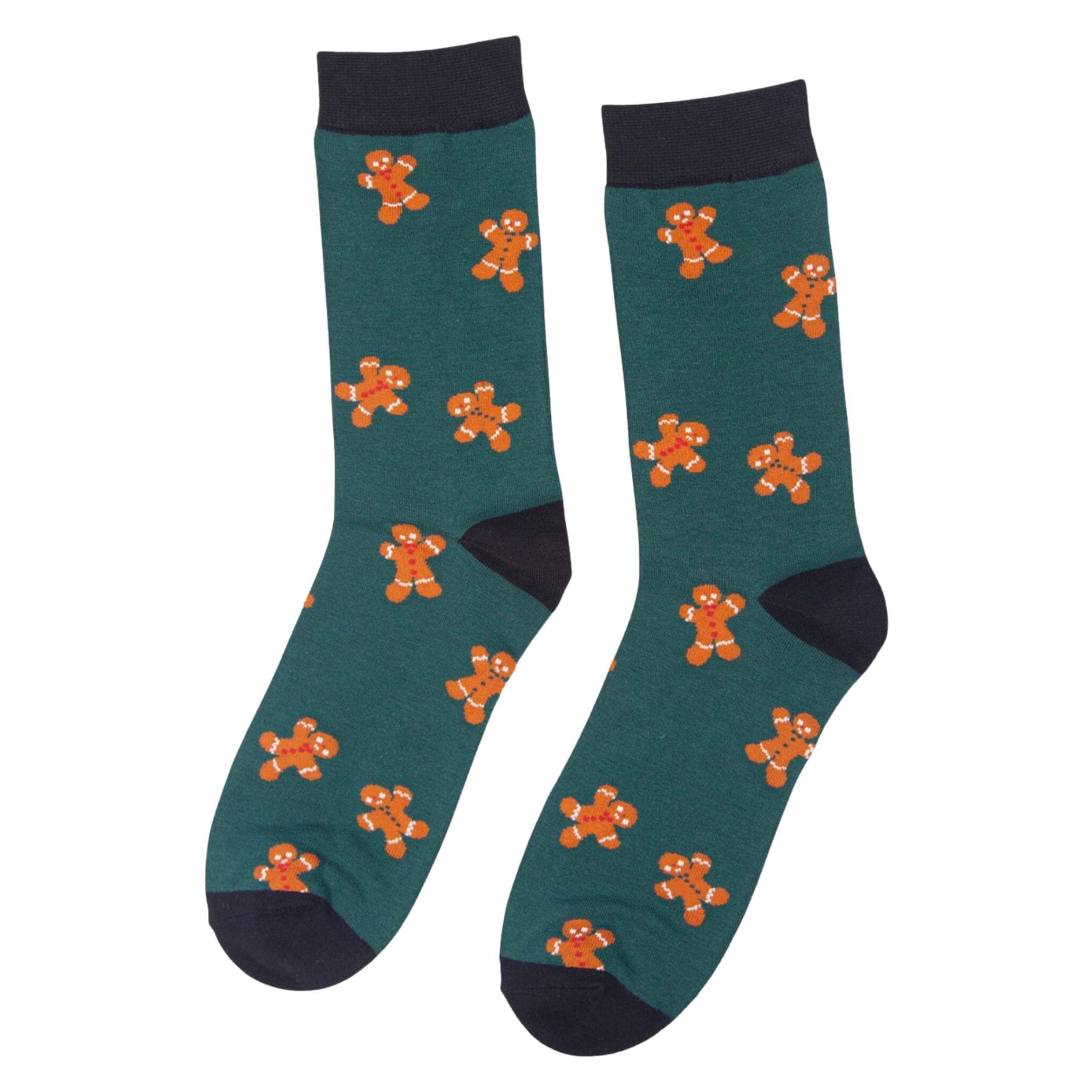 Pair of green socks with black cuffs, heels, and toes featuring a repeating orange gingerbread man pattern.