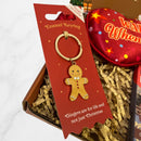 Festive enamel keyring featuring a smiling gingerbread man design on red packaging with the phrase “Gingers are for life and not just Christmas.”