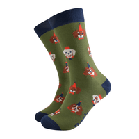 Pair of green socks with navy cuffs, heels, and toes, featuring a repeating pattern of cartoon dogs wearing party hats.