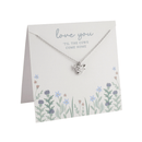Silver Highland cow necklace displayed on a floral card with the message “Love you ’til the cows come home.”