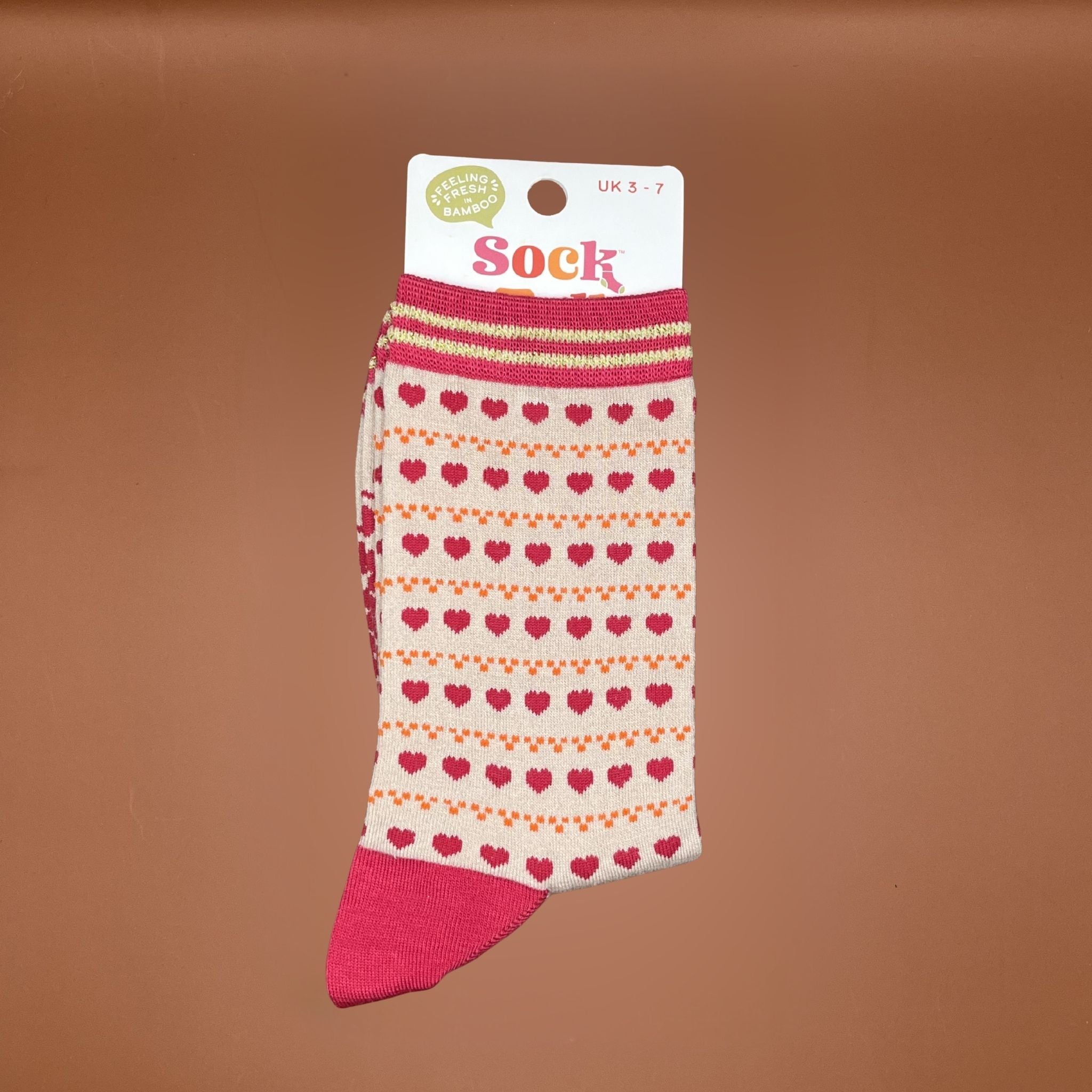 Womens pink and cream socks with heart pattern