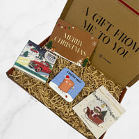 Gift box with Christmas-themed coaster, Christmas tree wish bracelet, and a Christmas-themed milk chocolate placed nicely in a gift box with a message card saying 'Merry Christmas'.