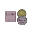 Purple Lovely Skincare mint to be box next to open tin of vanilla mint lip balm.