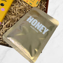LAPCOS Honey Nourishing face mask in gold packaging, placed inside a gift box with shredded paper filling.