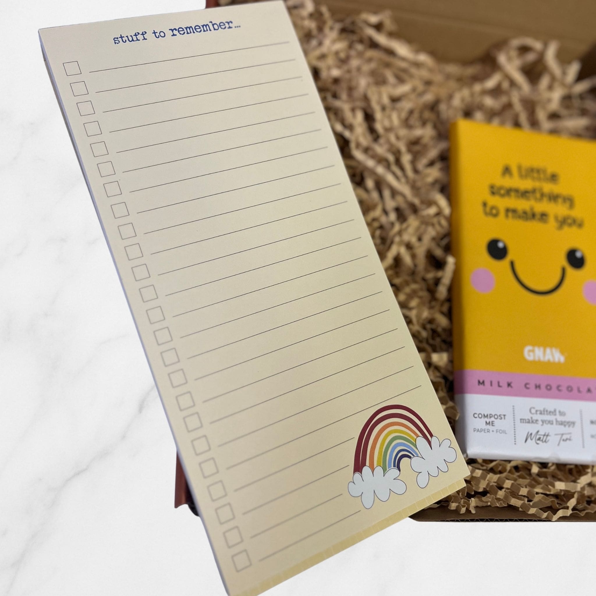 Open Dandelion Stationery notepad with “stuff to remember” heading and a small rainbow illustration at the bottom.