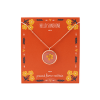 Pressed flower necklace on a 'Hello Sunshine' branded card with floral designs.