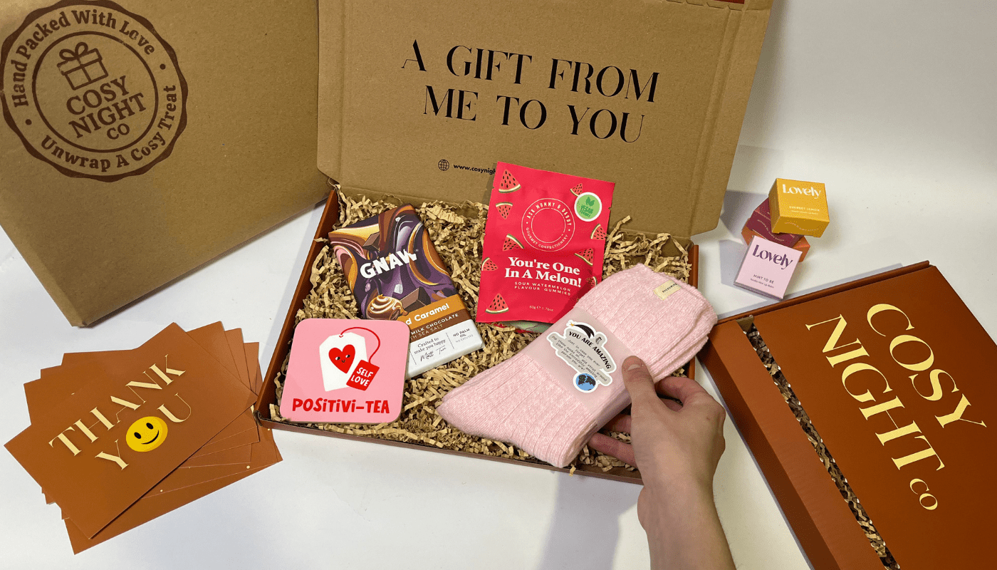 Cosy Night Co letterbox gift box with pink socks, chocolate, sweets, coaster, soap and thank you cards.