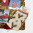 Christmas cream bamboo socks with red accents featuring a reindeer and holly design, presented inside a gift box.