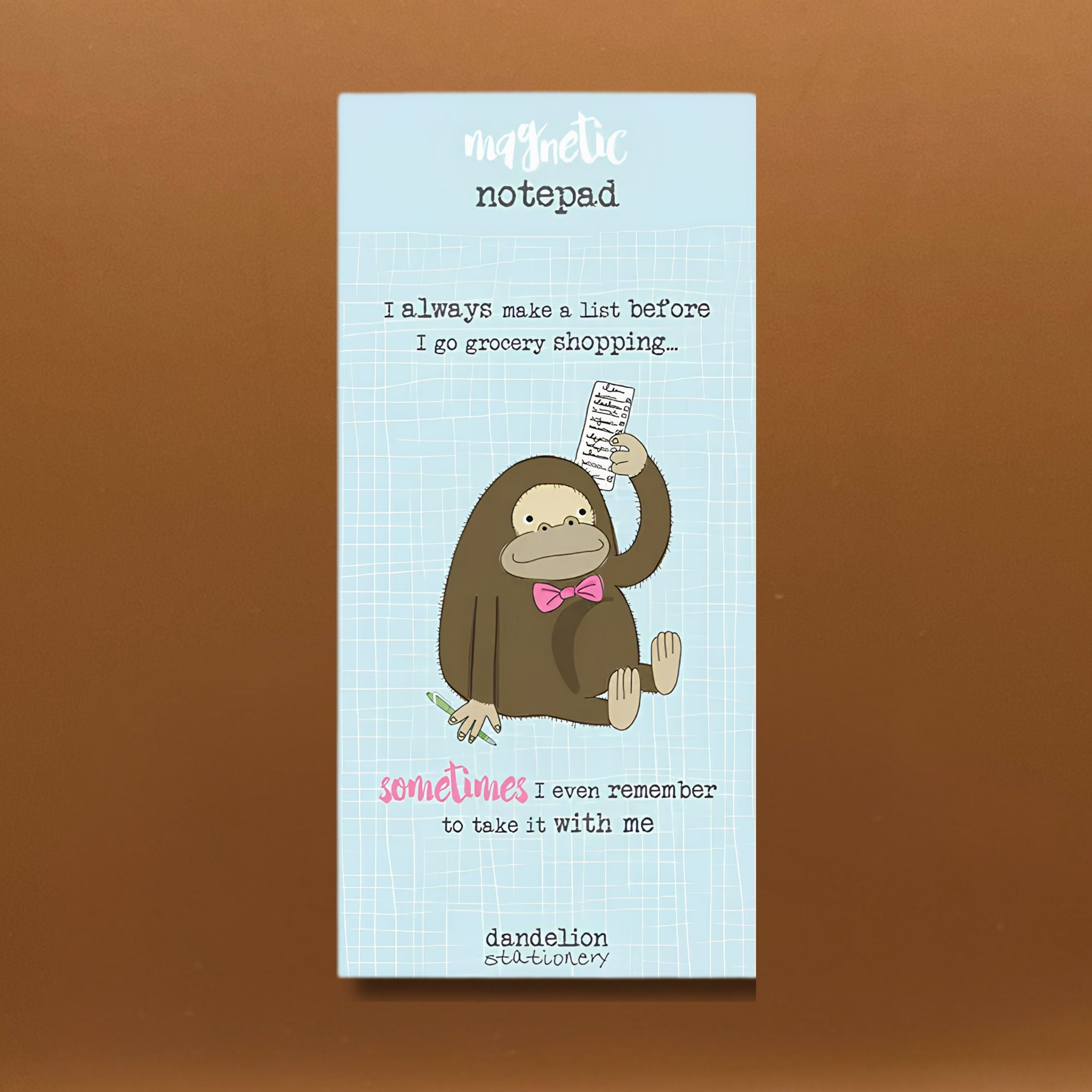 Shopping list notepad with a cartoon monkey holding a list